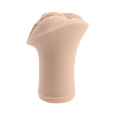 Compact flesh-toned flexible stroker with realistic lips and vaginal entry, designed for handheld use and travel.