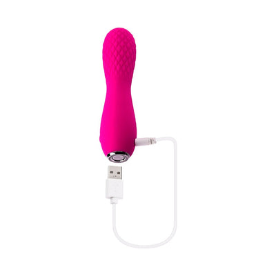 Pink silicone rechargeable mini vibrator with textured quilted tip and USB charging cable attached.