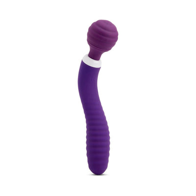 Purple flexible wand with textured handle and rounded head designed for targeted stimulation, standing upright on white background.