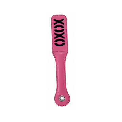 Pink vinyl paddle with black XOXO design and a metal grommet on the handle end.