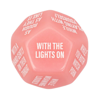 Pink 12-sided adult game dice with white text featuring playful intimate prompts for couples.