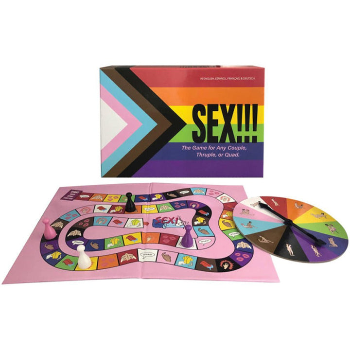 Sex-themed board game set with colorful game board, spinner, player pieces, and rainbow pride flag box design.