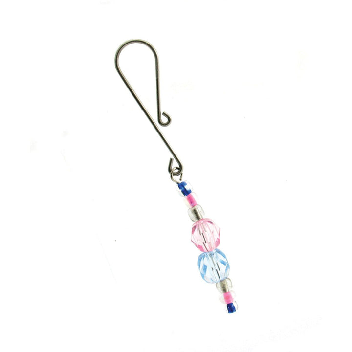 Beaded clitoral clamp with pink and blue decorative beads on a silver metal clasp against white background.