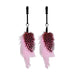 Pair of black nipple clamps adorned with soft pink and black spotted feathers for playful sensory teasing.