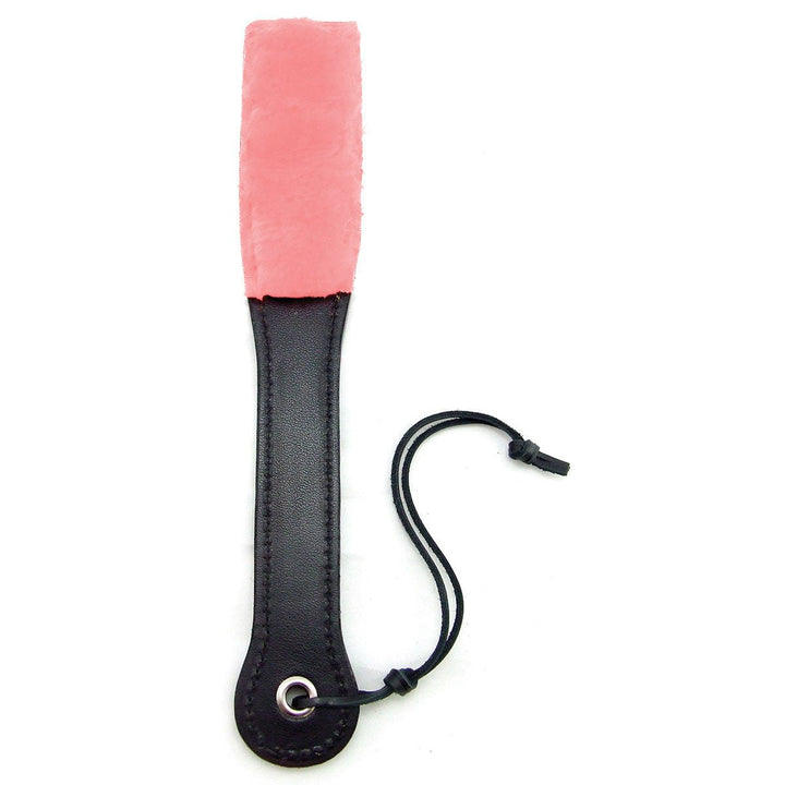 Black leather slapper with soft pink faux fur paddle and wrist strap on white background.