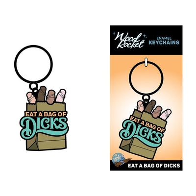 Enamel keychain featuring a paper bag filled with playful shapes and the phrase Eat A Bag Of Dicks in bold lettering.