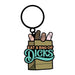 Enamel keychain featuring a paper bag with four colorful novelty shapes and the phrase Eat A Bag Of Dicks.