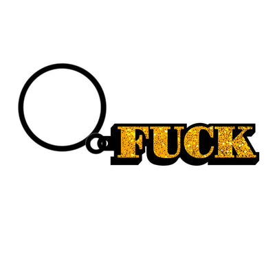 Gold glitter enamel keychain with bold black letters spelling a strong expression attached to a black key ring.