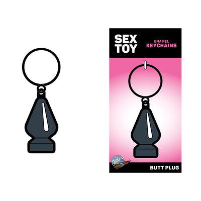 Gray enamel keychain shaped like a small butt plug with black outline on a pink and black backing card.