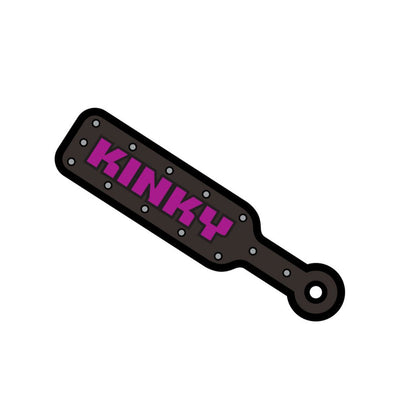 Black enamel pin shaped like a paddle with purple "KINKY" text and silver rivet details.