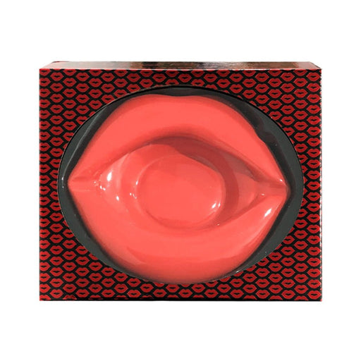 Glossy red lip-shaped porcelain ashtray in black and red lip-patterned gift box.
