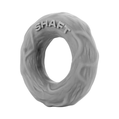 Small gray textured silicone shaft C-ring with raised "SHAFT" lettering on top.