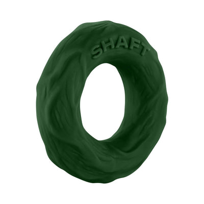 Small dark green textured silicone Shaft C-ring with embossed brand name on a white background.