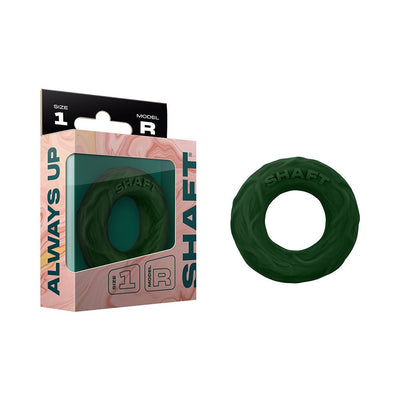 Small dark green Shaft Model R C-ring made of flexible silicone with textured surface, shown with packaging box.