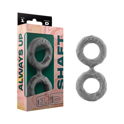 Shaft Double C-ring in small size made of textured gray silicone, shown with packaging box.