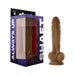 Realistic brown liquid silicone dildo with suction base and balls, displayed next to its purple and black packaging box.