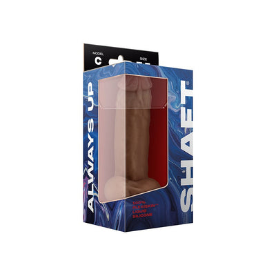 Shaft Model C 7.5-inch dual density silicone dildo in oak color with balls and suction cup in blue and black packaging.