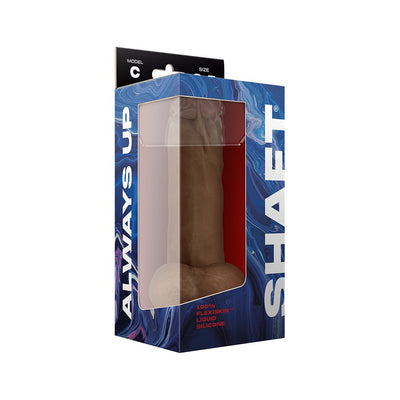 Shaft Model C 8.5-inch dual density silicone dildo in oak color with balls, displayed in blue and white packaging.