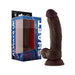 Realistic dark brown silicone dildo with suction base and balls, displayed next to blue and black packaging box.