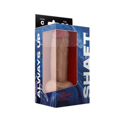 Shaft Model C liquid silicone dildo with balls in packaging, featuring a realistic curved design and suction base.