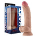 Realistic liquid silicone dildo with balls and suction base in pine color, next to its blue packaging box.