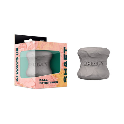 Gray flexible silicone ball stretcher with textured surface, shown with branded packaging box.