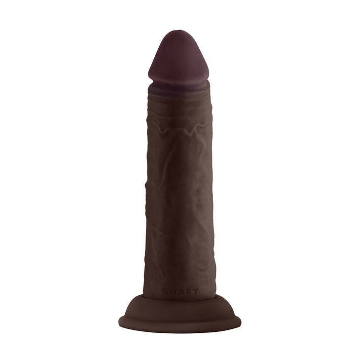 Mahogany-colored 5.5-inch Shaft Model J dildo with realistic texture and suction cup base.