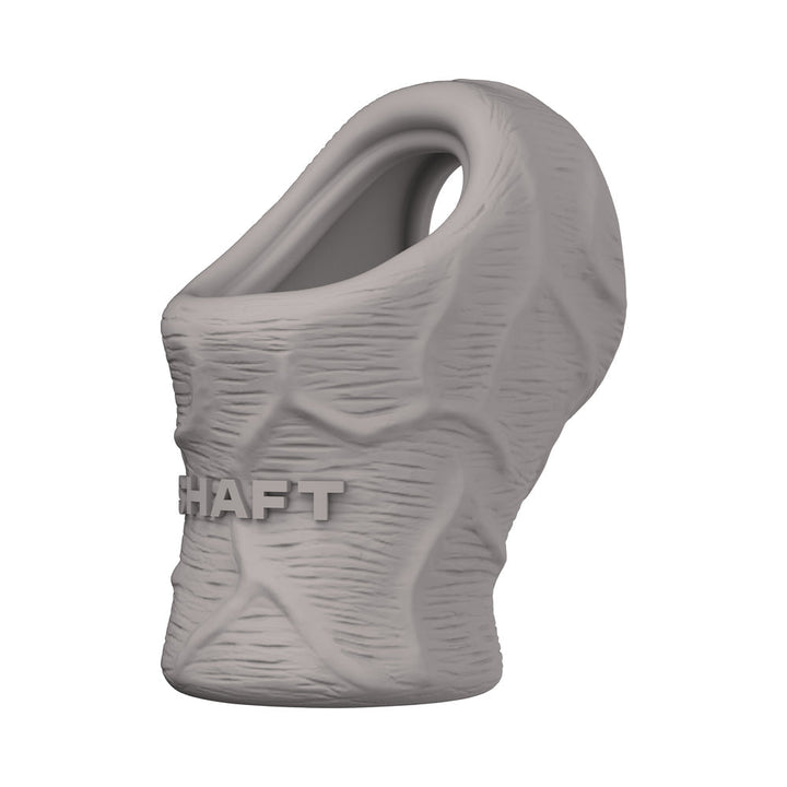Grey textured silicone cock and ball stretcher with embossed "SHAFT" branding and ergonomic design.