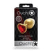 Packaging of Ouch! medium metal butt plug in gold with a ruby red heart-shaped gem base on a black patterned background.