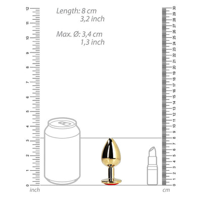 Medium gold aluminum butt plug with ruby red heart gem base shown next to size comparison graphics.