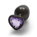 Medium gunmetal metal butt plug with a heart-shaped amethyst-colored jewel at the base on a white background.
