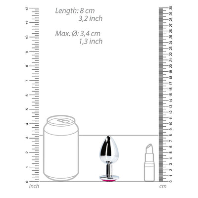 Medium silver metal butt plug with pink heart-shaped gem base shown next to size comparison graphics.