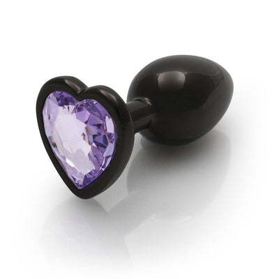 Small gunmetal metal butt plug with a heart-shaped amethyst-colored gem base, smooth and tapered for comfort.