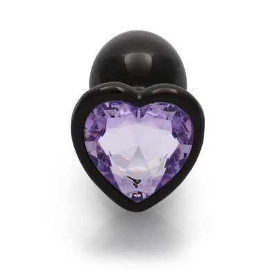 Small gunmetal metal plug with a heart-shaped amethyst-colored gem base, smooth and tapered for comfortable use.