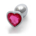 Small silver metal butt plug with a heart-shaped pink gem at the base, smooth and tapered design.