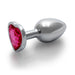 Small silver metal butt plug with a heart-shaped pink gem base, smooth tapered design for comfortable use.