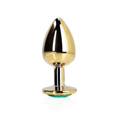 Large gold-toned metal butt plug with a tapered tip and green jewel base, polished smooth finish.
