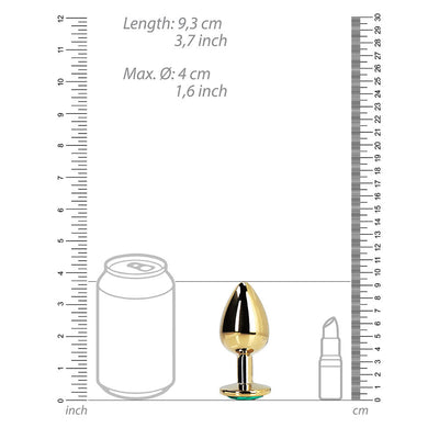 Gold-colored metal butt plug with a round jewel base, shown next to size comparison illustrations of a soda can and lipstick.