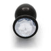 Large black round metal plug with a clear faceted gem base, smooth and polished finish.