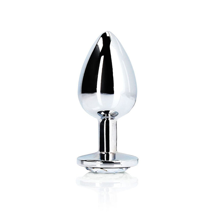 Large polished silver metal butt plug with a round jewel-encrusted base on a white background.