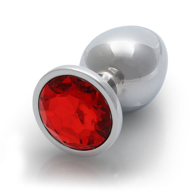Large smooth metal butt plug with a round red gem base, polished silver finish and tapered shape.