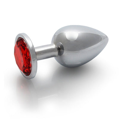 Large smooth metal butt plug with a tapered tip and red jewel base, designed for comfortable and stylish wear.