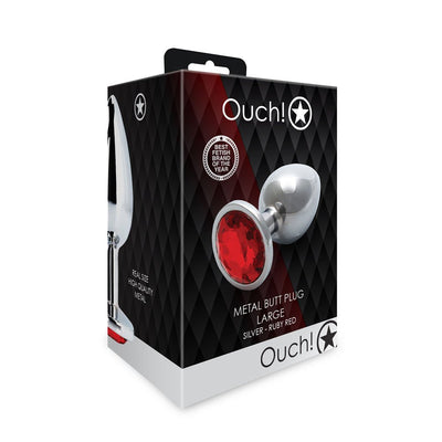 Packaging box of Shots Ouch! large silver metal butt plug with a red jewel base, featuring product image and branding.