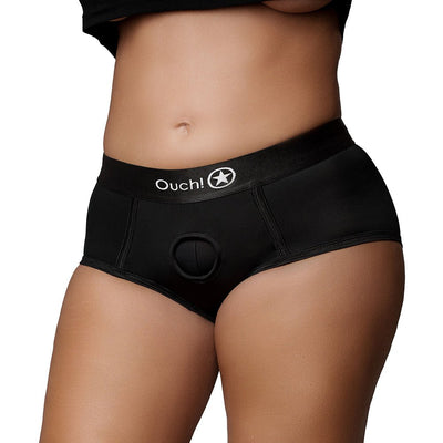 Close-up of mid-rise black vibrating strap-on brief with Ouch! logo on waistband, designed for comfort and versatile fit.