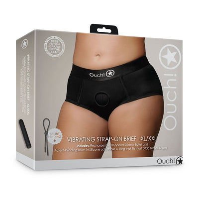 Packaging of Shots Ouch Vibrating Strap-On Brief in black, shown on model wearing mid-rise strap-on panties.