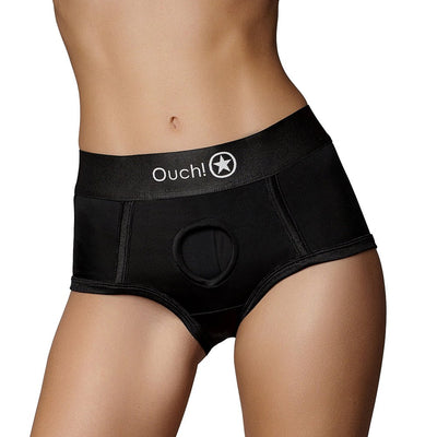 Black mid-rise vibrating strap-on brief with Ouch! logo and central O-ring opening, modeled on a torso.