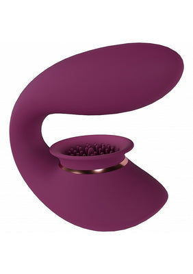 Purple silicone rechargeable vibrator with suction cup and textured stimulation surface, ergonomic curved design.
