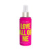 Bright pink Simply Sexy Love All Of Me pheromone body mist bottle with yellow text and white spray top.