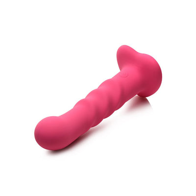 Pink ribbed silicone dildo with heart-shaped suction base and power button on white background.
