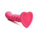 Pink ribbed silicone dildo with heart-shaped suction base shown on white background.